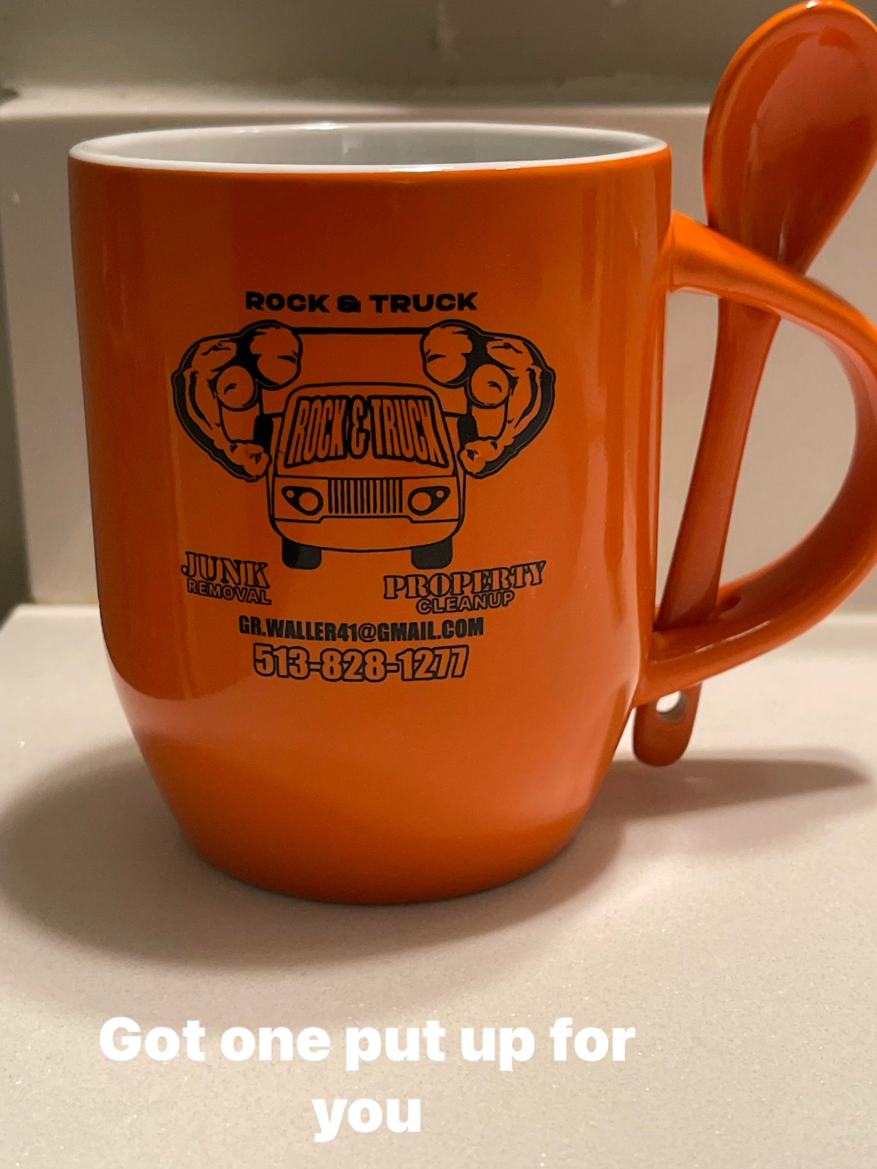 Orange/ black mug with spoon